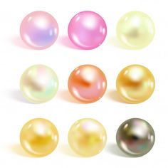 an assortment of different colored pearls on a white background