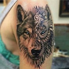 a woman's arm with a wolf tattoo on the left side of her body