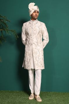 Ivory, white full sleeve sherwani with bead, cutdana embellishment in floral pattern. Paired with kurta and pant. - Aza Fashions Designer White Sherwani With Mirror Work, Fitted White Nehru Jacket With Mirror Work, Festive White Nehru Jacket With Mirror Work, White Sherwani With Mirror Work For Eid, Elegant White Bandhgala With Mirror Work, Formal White Kurta With Mirror Work, Designer White Bandhgala With Mirror Work, White Traditional Wear With Pearl Embroidery And Long Sleeves, White Bandhgala With Mirror Work For Eid