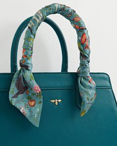 Key Features



Limited Edition Design: Inspired by joyful summer vibes, our Alice Structured Tote features the exclusive Into The Woods artist collaborative print by Catherine Rowe in vibrant Mermaid Teal.


Stylish Detailing: Includes a narrative printed silk twilly scarf wrapped around the handle, adding a chic and coordinated accent to the tote.


Versatile Accessory: Swap the tied twillys with our limited edition Into The Woods square scarves for a playful mix-and-match accessory statement, Fable England, Wood Tote, Swan Jewelry, The Woods, Luxury Christmas Gifts, Twilly Scarf, September Birthstone Jewelry, Polyester Scarf, Hand Painted Jewelry