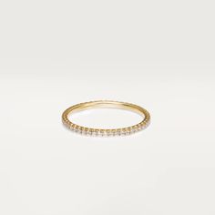 a yellow gold ring with small diamonds