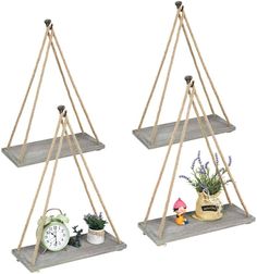 two wooden shelves with plants on them and an alarm clock in the middle one is hanging from rope