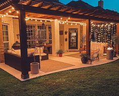 a patio covered in lights and potted plants