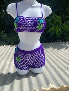 Purple mesh crochet set. Fits xxs-xs Would be low waisted and very cropped for a size S body.  Approximate size: Bust: 28.5 - 30.5 inches  Waist: 24-26 inches Hip: 31.5 - 33 inches PS. The flowers don't provide proper coverage, you will need to wear other garments under this set. Beach Mesh Crop Top With Stretch, Beach Mesh Stretch Crop Top, Stretch Mesh Crop Top For The Beach, Beach Stretch Mesh Crop Top, Summer Mesh Crop Top For The Beach, Summer Beach Mesh Crop Top, Fitted Lace Crochet Top For Beach Season, Fitted Lace Crop Top For Beach, Beach Lace Stretch Crop Top