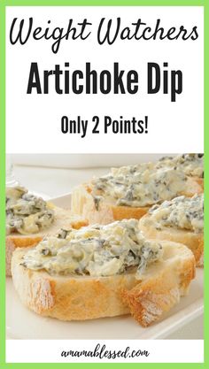 a white plate topped with pieces of bread covered in spinach artichoke dip