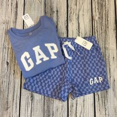 This Is A Very Cute Outfit. The Shirt Is Done In Purple With The Gap Logo On The Front & The Shorts And Done In A Purple Checkered Pattern. New With Tags. Gap Cotton Summer Sets, Casual Gap Sets For Spring, Casual Gap Playwear Sets, Gap Casual Playwear Sets, Summer Casual Sets By Gap, Casual Summer Sets From Gap, Casual Summer Sets By Gap, Casual Gap Tops For Playwear, Shirt Shorts Outfit