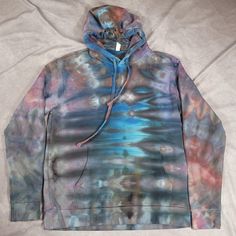 Abstract pattern with shades of grey, red, blue and orange throughout.  Made with 80/20% Next Level brand. Item has been washed multiple times at this point and will not risk bleeding. Multicolor Drawstring Hooded Sweatshirt, Multicolor Casual Sweatshirt With Kangaroo Pocket, Casual Multicolor Hooded Hoodie, Acid Wash Soft-washed Hooded Sweatshirt, Acid Wash Hooded Soft-washed Sweatshirt, Faded Hooded Sweatshirt Soft-washed, Faded Long Sleeve Soft-washed Hoodie, Multicolor Hoodie With Kangaroo Pocket For Fall, Acid Wash Cotton Hoodie