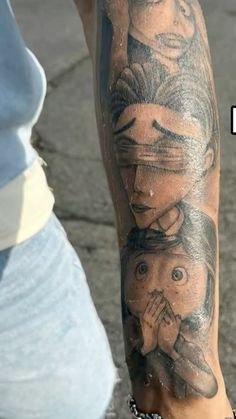 a person with a tattoo on their arm and the image of two people behind them