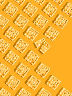 an image of many waffles that are arranged in the shape of squares on a yellow background