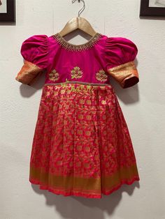 BUYER'S PLEASE LEAVE YOUR CONTACT NUMBER. It's necessary for shipping. READY TO DISPATCH Age: 0-2 Years. Baby girls dark pink silk and Banarasi chanderi brocade frock. The Yoke portion of frock made with soft silk with floral butta design and the skirt portion is made on Banarasi chanderi brocade- chanderi silk fabric. The dress is fully lined with soft cotton and the stitches are concealed. So your little princess feels comfortable in this frock. Please Visit Our Shop For More Unique Collection Pink Festive Dress With Short Sleeves, Pink Festive Short Sleeve Dress, Festive Pink Short Sleeve Dress, Pink Short Sleeve Festive Dress, Pink Short Sleeve Dress For Festivals, Pink Short Sleeve Festival Dress, Festive Fitted Pink Frock, Festive Pink Short Sleeve Set, Pink Frock