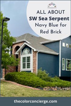 a blue house with the words all about sw sea serpent navy blue for red brick