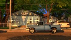 a truck parked in front of a house