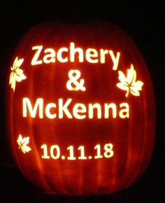 a carved pumpkin with the name and date on it