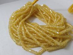 "PRODUCT DETAILS: AAA Yellow Cubic Zirconia Faceted Beads 13\" Strand Image contains: 4 Strands Size: 3-3.2mm Package includes: 1 Strand Shape : Rondelle Cut : Faceted Quality : Grade AAA (Excellent) Length (Approx) : 12-13 Inches Drill-Hole Type : Center Thank for Shopping Visiting our Shop. Use code : FLAT07 for flat 5% off on orders above 25$. More Fine Beads : https://www.etsy.com/shop/akgemsbeads If you still need something which you are unable to find it on our shop, let me know by Startin Gemstone Beads Wholesale, Gemstone Beads Jewelry, Necklace Beads, Cubic Zirconia Necklace, Semi Precious Jewelry, Zircon Jewelry, Cubic Zirconia Jewelry, Wholesale Beads, Faceted Gemstones