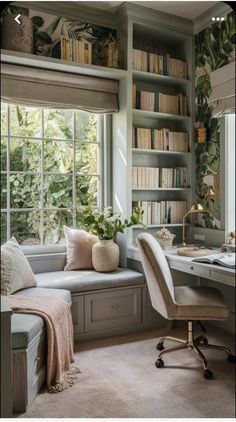 a home office with lots of bookshelves and plants in the window sill