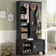 an entryway with a coat rack, hat and shoes on it's shelf