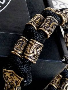 "Runic bracelet \"VIKING\" from a paracord with a clasp \"THOR'S HAMMER\". Runes \"teyvaz\" and \"algiz\". Viking style. Stylish handmade paracord bracelets for those who are always moving forward. These fashion accessories are made of extremely durable, scratch-resistant rope and original brass beads. This bracelet has two very strong runes \"TEYVAZ\" and \"ALGIZ\". These two runes give your bracelet magical powers. These bracelets are ideal for both men and women. Each bracelet is precisely ma