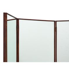 a room divider made out of wood and glass with a white wall in the background