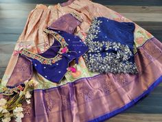 This Traditional Half Saree Set is a must-have for any woman looking to add a touch of elegance and tradition to her wardrobe. Made from premium quality Kanchi material, this saree set is not only beautiful but also durable and comfortable to wear. The set includes a blouse that is stitched and comes in a size 34, with inner margins that can be expanded up to size 40. For those who need a size 32, alterations can be done upon request. The lehenga is also expandable and has inner margins to incre Elegant Multicolor Sets With Traditional Drape, Elegant Multicolor Sets For Navratri, Designer Wear Sets With Unstitched Blouse, Elegant Multicolor Self Design Sets, Elegant Multicolor Self-design Sets, Traditional Designer Sets With Unstitched Blouse, Traditional Designer Wear Sets With Unstitched Blouse, Designer Wear Saree Sets With Self Design, Silk Unstitched Blouse Set With Traditional Drape