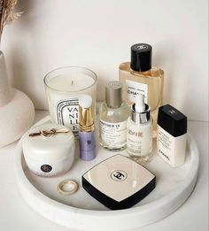 an assortment of skin care products on a white tray