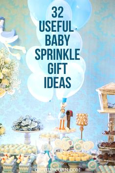 a baby sprinkle gift is displayed on a table with balloons and cupcakes