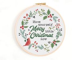 a cross stitch christmas wreath with the words have yourself merry little christmas now on it