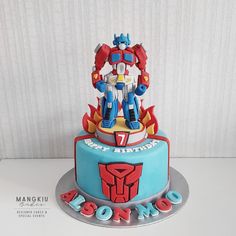 a birthday cake decorated to look like a robot from the movie's animated tv series