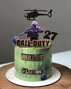 a birthday cake with a green frosting that says, call duty 27 warzone lucas