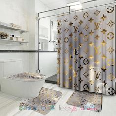 the bathroom is decorated in gold and silver colors with custom name on the shower curtain