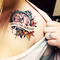 a woman with a clock tattoo on her chest that says until the verment