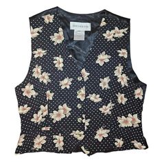 Channel your inner Phoebe Buffay with this vintage 1990s polka dot vest, perfect for adding a touch of whimsical Corpcore charm to your business casual wardrobe. With its playful flowers and polka dots, this vest brings a twee twist to office attire, offering a chic nod to '90s nostalgia. Womens Vintage polka dot floral vestbusiness casual chicbutton up faux pockets adjustable back strap for waist chest 40in  shoulder to shoulder 14in  shoulder to hem 19in   Twee retro quirky indie pop cute Phoe Business Casual Chic, Polka Dot Vest, Style Désinvolte Chic, Phoebe Buffay, Chic Flowers, Indie Pop, 90s Nostalgia, Office Attire, Vest Outfits