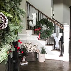 christmas decorations on the banisters and stairs in a home