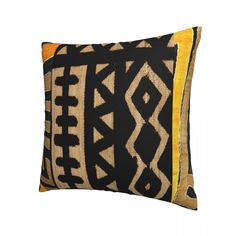 a black and yellow pillow on a white background