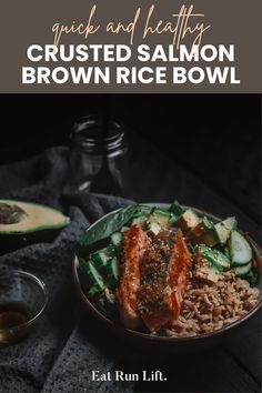 a bowl filled with rice and meat next to an avocado