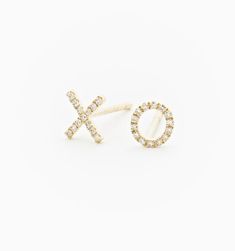 Put a little love into your ear stack with these simple and sweet diamond XO earrings. The dainty mismatched pair will add a playful touch to your minimalist earring combinations! Available in 14k White Gold and Yellow Gold Total Diamond Carat Weight: 0.05 ct Diamond Color: G, Clarity: SI1 Made to order. Lead time is 2-4 weeks. Benefits of Solid 14k Gold Jewelry Most loved for its durability and longevity Can be worn daily and requires less maintenance and care than plated, vermeil, or silver je Earring Combinations, Sealed With A Kiss, Minimalist Earring, Modern Jewellery Design, Ear Stack, Diamond Stud Earrings, A Kiss, Diamond Stud, Bezel Diamond