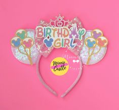 a minnie mouse ears headband with the words happy birthday girl on it's side