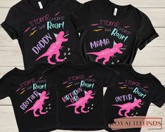 three matching shirts with pink and purple dinosaurs on them, one is for the child's name