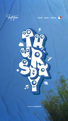 a blue poster with white letters and monsters on it's side, in front of a tree