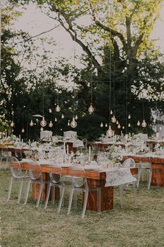 an outdoor table set up for a wedding reception