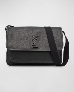 Saint Laurent "Niki" messenger bag in graned leather with tonal matte Cassandre hardware    Adjustable webbing shoulder strap; approx. 12.927.5"L    Flap top with magnetic snap closure    Exterior, one back slip pocket    Interior, two main compartments, one zip pocket    Approx. 9"H x 12.7"W x 3.9"D    Made in Italy Sisley Paris, Beauty Event, Manolo Blahnik, Messenger Bag, Zip Pockets, Leather Bag, Burberry, Christian Louboutin, Shoulder Strap