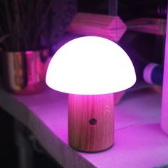 a mushroom shaped light sitting on top of a table