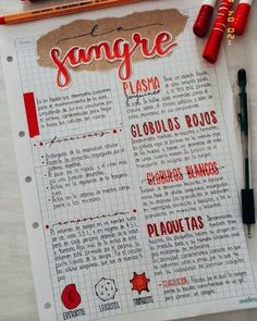 a menu with some writing on it next to markers and pencils, including two crayons