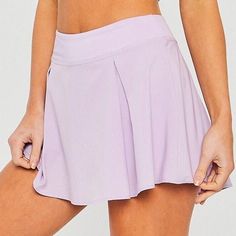 Sports Skirted Shorts, Solid Sports Skort With Lined Skirt, Purple Skort With Built-in Shorts, Purple Stretch Skort For Sports, Solid Mini Skort For Sports, Solid Tennis Skirt With Lined Skirt For Workout, Solid Color Lined Tennis Skirt For Workout, Solid Color Tennis Skirt With Lined Skirt For Workout, Solid Color Mini Skort For Sports