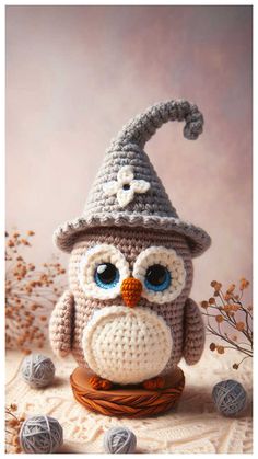 a crocheted owl sitting on top of a table