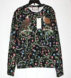 Animals continue to inspire Gucci this season; embodying the brand’s quirky spirit this sweatshirt is adorned with birds  and winding vines. Expertly crafted in Italy, the slightly loose fit ensures that it will wear well with jeans and sneakers.  The sweatshirt has become a core design of Gucci's latest collections.  For Gucci's Cruise collection, the basic sweatshirt has been re-worked in felted cotton jersey with an allover print  featuring various birds of prey set against a floral and vine motif.   This multi-colored Gucci 'Birds of Prey' cotton sweatshirt will be the pick of the bunch in your tops department.  After all, this vibrant sweatshirt was created by Michele and he clearly has a knack for making desirable garms.  Crafted from felted cotton jersey, this jumper features a crew