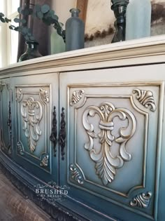 an old dresser has ornate carvings on it