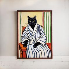 a black cat sitting in a bathrobe on top of a wooden shelf next to a wall