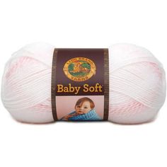 a ball of baby soft yarn in pink and white with a brown label on it