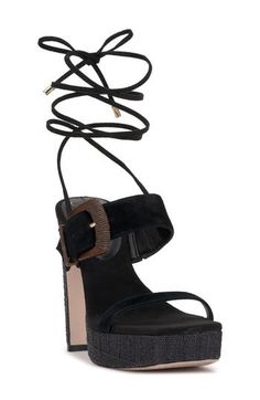 A pronounced instep buckle and wraparound ankle ties lend visual intrigue to a lofty sandal set on a chunky platform and soaring block heel. 4 1/2" heel; 1" platform Wraparound ankle strap with tie closure Leather upper/synthetic lining/rubber sole Imported Adjustable Platform Lace-up Sandals With Ankle Strap, Chic Sandals With Stacked Heel And Ankle Tie, Adjustable Ankle Strap Platform Lace-up Sandals, Adjustable Ankle Strap Lace-up Sandals With Platform, Adjustable Wedge Heels With Wrapped Heel, Adjustable Wrapped Wedge Heels, Chic Adjustable Wedge Sandals With Block Heel, Chic Adjustable Ankle Strap Wedge Sandals, Adjustable High Heel Wedge Sandals With Buckle