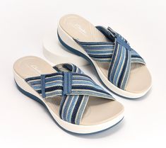 Set out for summer adventures in the cushioned comfort of the Arla Wave slide. This sporty slip-on style is adjustable so you can easily enjoy a secure fit. From Clarks Footwear. Comfortable Slip-on Slides With Ortholite Insole, Adjustable Slip-resistant Slides For Beach, Non-slip Slip-on Beach Slides, Slip-on Beach Slippers With Rubber Sole, Rubber Sole Slip-on Beach Slippers, Oxford Flats, Oxford Heels, Flip Flop Slippers, Summer Adventures